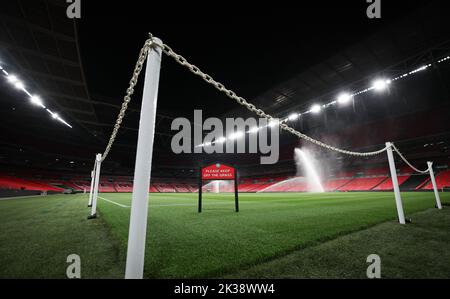 London, UK. 25th Sep, 2022. Soccer: Nations League A, before the match England - Germany. The turf at Wembley Stadium is watered the night before the match. Credit: Christian Charisius/dpa - IMPORTANT NOTE: In accordance with the requirements of the DFL Deutsche Fußball Liga and the DFB Deutscher Fußball-Bund, it is prohibited to use or have used photographs taken in the stadium and/or of the match in the form of sequence pictures and/or video-like photo series./dpa/Alamy Live News Stock Photo