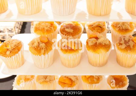 Vietnamese salted egg yolk cupcake on white tray Stock Photo