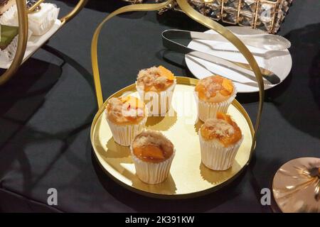 Vietnamese salted egg yolk cupcake on golden tray Stock Photo