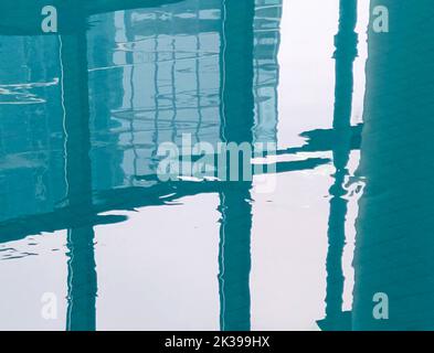 City building reflection in swimming pool water Stock Photo