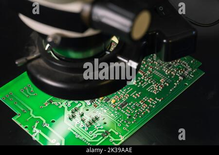 Repair process of modern electronics. Specialistic equipment used to change broken socketed components for a new ones. High quality photo Stock Photo