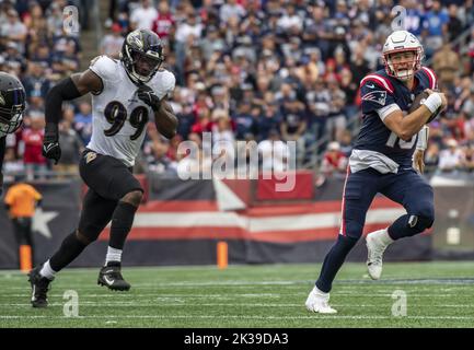 Foxborough, United States. 25th Sep, 2022. New England Patriots quarterback Mac Jones runs the ball from Baltimore Ravens Odafe Oweh during a game at Gillette Stadium in Foxborough, Massachusetts on Sunday, September 25, 2022. Photo by Amanda Sabga/UPI Credit: UPI/Alamy Live News Stock Photo