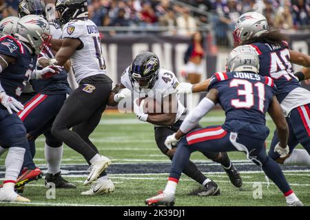 Foxborough, United States. 25th Sep, 2022. Baltimore Ravens running back Justice Hill runs the ball through New England Patriots defense during a game at Gillette Stadium in Foxborough, Massachusetts on Sunday, September 25, 2022. Photo by Amanda Sabga/UPI Credit: UPI/Alamy Live News Stock Photo