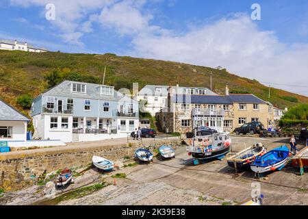 Fishing boats on the slipway in the harbour at Mullion Cove, a small port on the west coast of the Lizard Peninsula, Cornwall, on eastern Mount's Bay Stock Photo