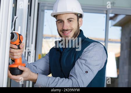 tradesman using cordless drill Stock Photo