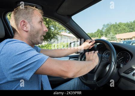 male driver honking the car horn Stock Photo