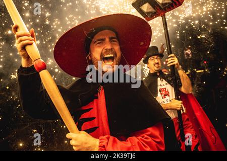 Barcelona, Spain. 25th Sep, 2022. A devil sets off his fireworks among the crowd of spectators at the Merce Festival of Barcelona. Credit: Matthias Oesterle/Alamy Live News Stock Photo