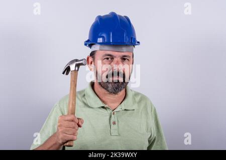 Portrait of 60 years old professional heavy industry engineer/worker wearing hardhat Stock Photo