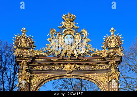 The coat of arms of French king Louis XV on the wrought iron gate of the Neptune Fountain at Place Stanislas in Nancy (Meurthe-et-Moselle), France Stock Photo