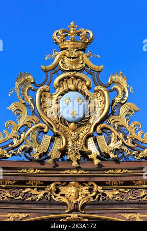 The coat of arms of French king Louis XV on the wrought iron gate of the Neptune Fountain at Place Stanislas in Nancy (Meurthe-et-Moselle), France Stock Photo