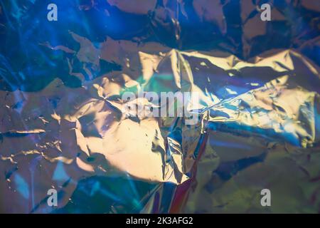 https://l450v.alamy.com/450v/2k3afg2/abstract-fashionable-blue-holographic-background-the-texture-of-the-foil-with-scratches-and-irregularities-crumpled-iridescent-foil-of-real-texture-high-quality-photo-2k3afg2.jpg