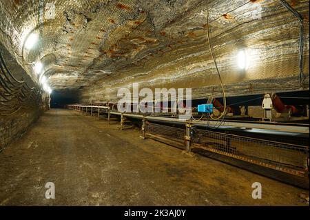 Production conveyor with steps and service ground in quarry Stock Photo