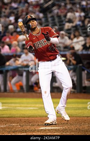 Arizona Diamondbacks' Sergio Alcantara (43) fields a grand out hit by St.  Louis Cardinals Tyler O'Neill during the fourth inning of a baseball game,  Friday, Aug. 19, 2022, in Phoenix. (AP Photo/Matt