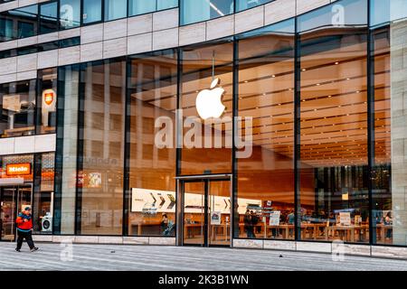 21 July 2022, Dusseldorf, Germany: Apple logo at the entrance to the store. Buying modern iphones and electronics. Phones and macintosh at the display Stock Photo