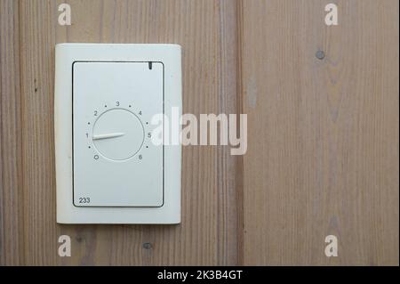 control for underfloor heating on a pine panel, Denmark, September 20, 2022 Stock Photo