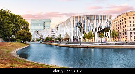 21 July 2022, Dusseldorf, Germany: Cityscape with Ko Bogen famous architecture building and water channel. Visit business and shopping center. Stock Photo