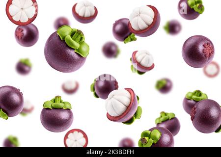 Falling mangosteen isolated on white background, selective focus Stock Photo