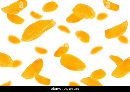Falling Dried Mango, isolated on white background, selective focus Stock Photo