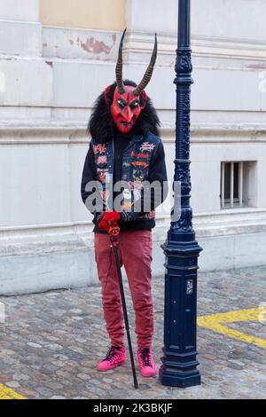 Switzerland, Basel, 7 March 2022. Single carnival participant wearing a devils mask Stock Photo