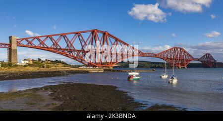 The mighty Forth rail bridge spreading across the Firth of Forth connecting north and south Queensferry. Taken from North Queensferry. Stock Photo