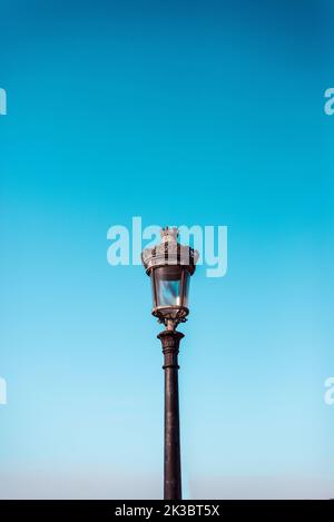 Victorian streetlight against plain sky Stock Photo