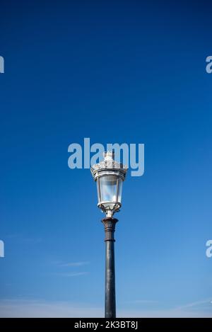 Victorian streetlight against plain sky Stock Photo