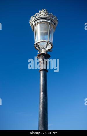 Victorian streetlight against plain sky Stock Photo