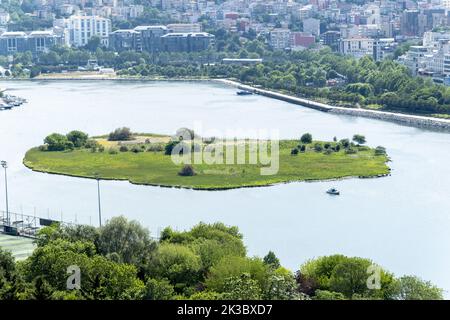 Wide Golden Horn island view from Pierre Loti, known as Halic, Golden Horn with trees and buildings, sunny day and blue sky, beautiful landscape Stock Photo