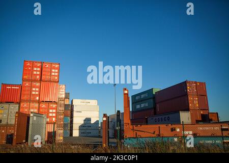 Containers waiting for transporation in the harbor of Antwerp, Belgium Stock Photo