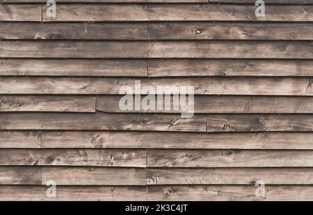Rustic brown wood cladding texture, horizontal unpainted old wood planks background Stock Photo