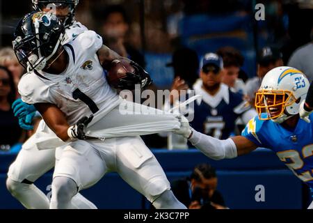 Los Angeles, United States. 25th Sep, 2022. Jacksonville Jaguars running back Travis Etienne (No.1) and Los Angeles Chargers cornerback Bryce Callahan (No.23) in action during the NFL football game between Los Angeles Chargers and Jacksonville Jaguars at SoFi Stadium. Final score; Chargers 10:38 Jaguars. Credit: SOPA Images Limited/Alamy Live News Stock Photo