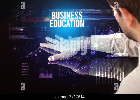 Businessman touching huge screen concept Stock Photo