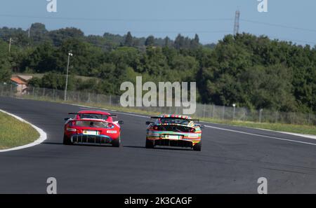 Lotus Exige race cars challenge overtaking on racetrack rear view. Vallelunga 10-11 september 2022, Racing weekend Stock Photo