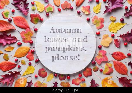 Fall circular background with various Autumn leaves, red, orange and yellow. Text Autumn leaves and pumpkins, please on the stone. Flat lay, natural Stock Photo