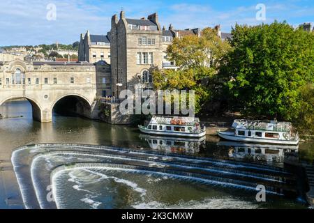 Tourist boats on the River Avon at Pulteney Weir in Bath. Stock Photo