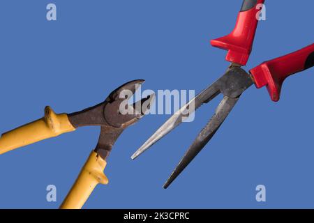 different cutting pliers, with blue background Stock Photo
