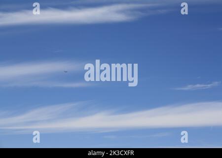Clouds of veil on bright blue sky Stock Photo