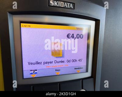 Basel, Switzerland - Sep 22, 2022: parking meter with price of 4 euros for 45 minutes in in the international airport Skidata device Stock Photo