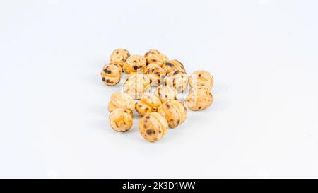 Roasted chickpea. Group of roasted chickpeas isolated on white background. selective focus. Leblebi in Turkish Stock Photo
