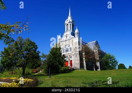 SAINT-SAUVEUR, CANADA -15 SEP 2022- View of the Paroisse Saint-Sauveur church in the village of Saint-Sauveur, a ski resort town in the Laurentians to Stock Photo