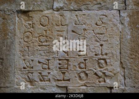 Capestrano - Abruzzo - Abbey of San Pietro ad Oratorium - The most enigmatic element on the left of the portal is the 'Square of Sator' Stock Photo