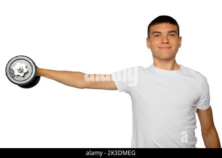 19 year old teenage boy lifting dumbbells Stock Photo