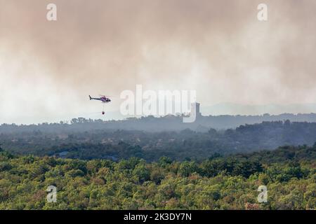 Kostanjevica na Krasu, Slovenia - July 17th 2022: Italian helicopter helping slovenian firefighters with wildfire in Karst Stock Photo