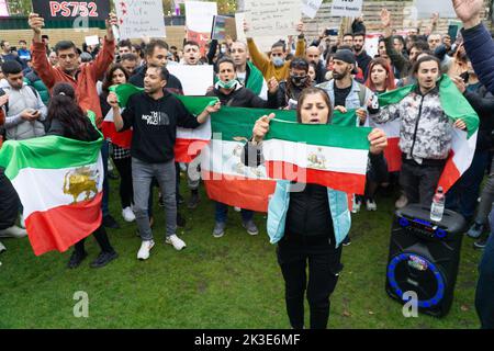 Manchester, UK, 25 Septemb3er 2022: At Picadilly Gardens in Manchester approximately two hundred Iranian expatriates protested against the current Iranian government and called for regime change. Waving the old Iranian pre-Revolutionary flag, protestors chanted the name of Mahsa Amini who was recently killed by Iran's Revolutionary Guard for not covering her hair. Anna Watson/Alamy Live News Stock Photo