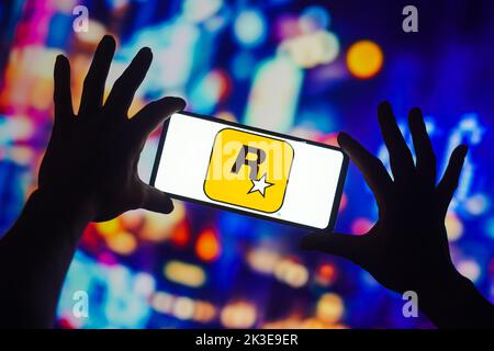 In this photo illustration a Rockstar Games logo seen displayed on a  smartphone with video games cover in the background. (Photo by Thiago  Prudencio / SOPA Images/Sipa USA Stock Photo - Alamy