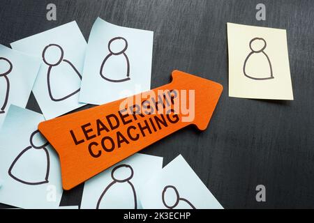 Leadership coaching concept. Stickers with figures and arrow. Stock Photo