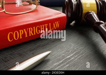 A book copyright law near wooden gavel. Stock Photo