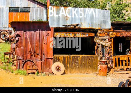Old Wood And Metal Blacksmith Building At Ghost Town Stock Photo