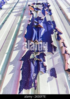 Badly peeling paint on metal cladding of modern building - Chatellerault, Vienne (86), France. Stock Photo