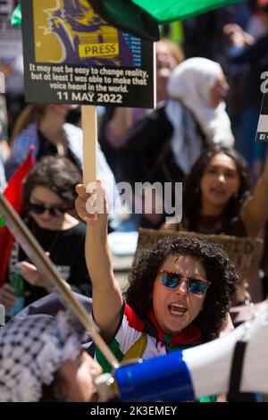 Participants gather during ‘National Demonstration: END APARTHEID – FREE PALESTINE!’ near the BBC Broadcasting House in London. Stock Photo